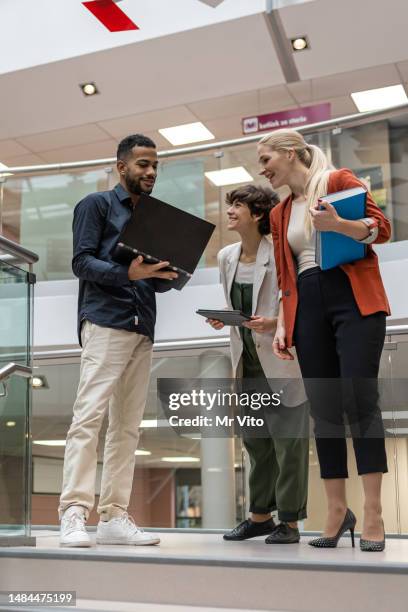 students on the stairs of the university libraries. - university debate stock pictures, royalty-free photos & images