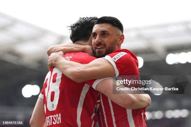 Michael Gregoritsch of Sport-Club Freiburg celebrates with teammate Vincenzo Grifo after scoring the team's first goal during the Bundesliga match...