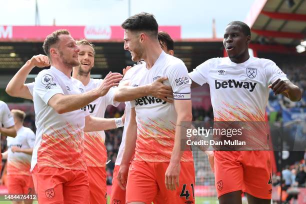 Declan Rice of West Ham United celebrates with teammates after scoring the team's third goal during the Premier League match between AFC Bournemouth...