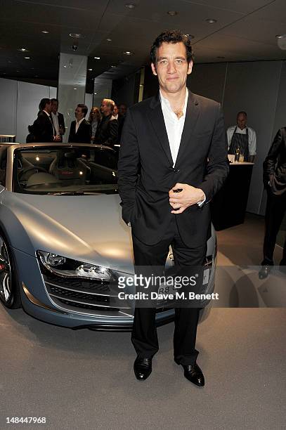 Actor Clive Owen attends a party celebrating the global launch of Audi City, Audi's first digital showroom, featuring an art installation by Chris...