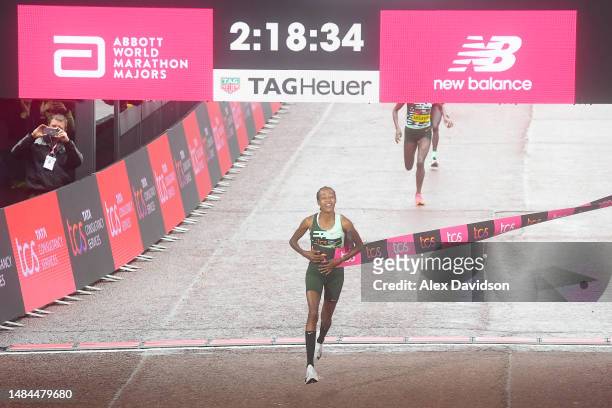 Sifan Hassan of Netherlands celebrates while crossing the finish line to win the Elite Woman's Marathon during the 2023 TCS London Marathon on April...