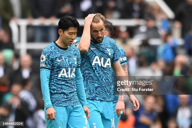 Son Heung-Min and Harry Kane of Tottenham Hotspur react after Newcastle United scored their sides fourth goal during the Premier League match between...