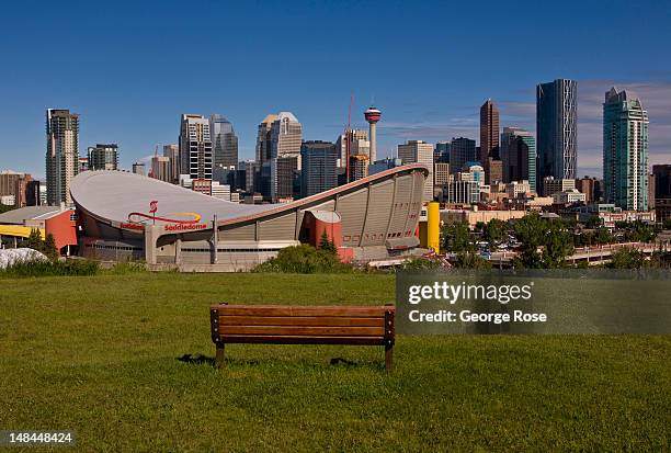 The downtown skyline, the Saddledome, and Stampede Park is viewed from a hill to the southeast on July 3, 2012 in Calgary, Canada. Calgary, home to...