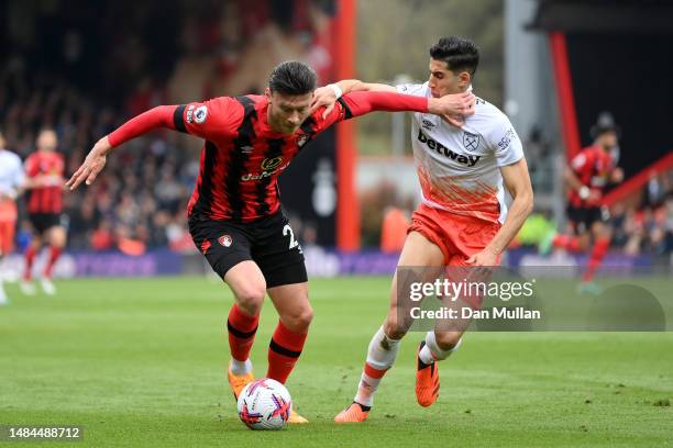 Kieffer Moore of AFC Bournemouth battles for possession with Nayef Aguerd of West Ham United during the Premier League match between AFC Bournemouth...