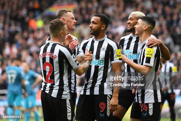 Callum Wilson of Newcastle United celebrates with teammates after scoring the team's sixth goal during the Premier League match between Newcastle...