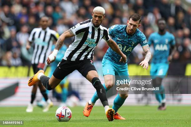 Joelinton of Newcastle United battles for possession with Pierre-Emile Hojbjerg of Tottenham Hotspur during the Premier League match between...