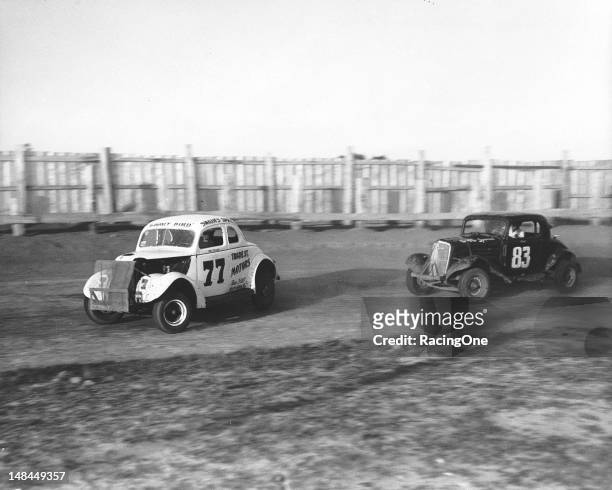 Ted Swaim of High Point, NC, keeps his “Gooney Bird” Modified stock car ahead of a fellow competitor during a race at Greensboro Fairgrounds.