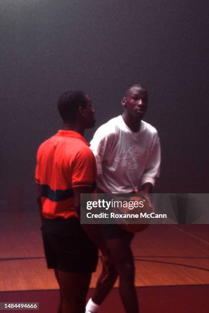 Chicago Bulls basketball player Michael Jordan is about to shoot a Wilson basketball while filming a Nike Air Jordan II Rock-A-Baby television...