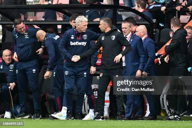 David Moyes, Manager of West Ham United, and Gary O'Neil, Manager of AFC Bournemouth, shake hands following the Premier League match between AFC...