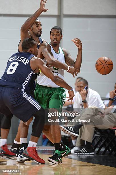 Kris Joseph of the Boston Celtics passes against Elijah Millsap of the Atlanta Hawks during NBA Summer League on July 15, 2012 at the Cox Pavilion in...