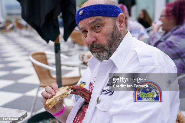 Man in Sci Fi costume from the movie Alien shares his lunch on the second day of the Scarborough Sci-Fi weekend on April 23, 2023 in Scarborough,...