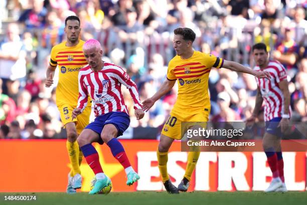 Antoine Griezmann of Atletico Madrid battles for possession with Gavi of FC Barcelona during the LaLiga Santander match between FC Barcelona and...