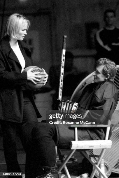 Actress Janet-Marie Jones holds a Wilson basketball while talking to husband Wayne Gretzky, Hockey Hall of Fame inductee, National Hockey League...