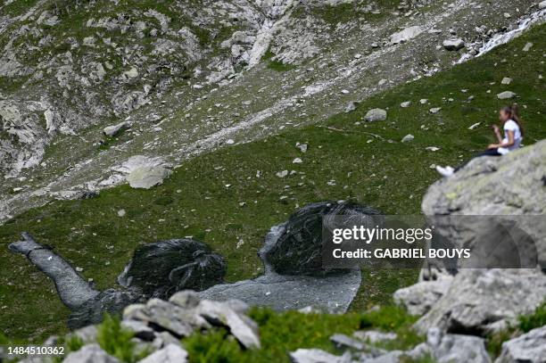 This photograph shows French Land artist Guillaume Legros aka "Saype" new giant land art fresco entitled: "La Grande Dame" in Courmayeur, on July 3,...