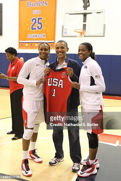 President of the United States of America Barack Obama with Tamika Catchings and Swin Cash of the 2012 US Women's Senior National Team following a...