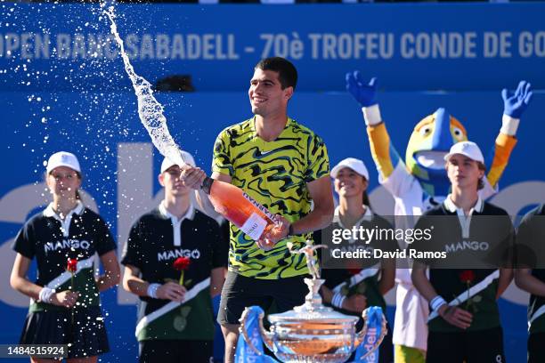 Carlos Alcaraz of Spain sprays champagne after beating Stefanos Tsitsipas of Greece during the Men's Singles Final on Day Seven of the Barcelona Open...