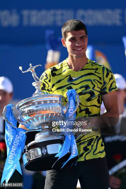 Carlos Alcaraz of Spain lifts the winners trophy after beating Stefanos Tsitsipas of Greece during the Men's Singles Final on Day Seven of the...