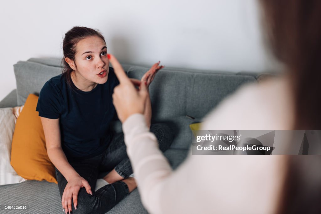 Mother and Daughter Working Through Conflict in Living Room