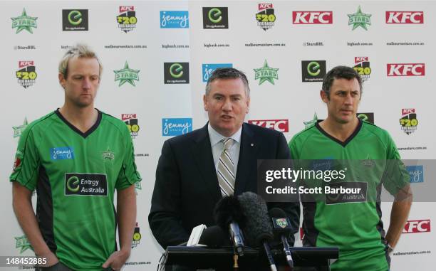 David Hussey and Cameron White of the Stars cricket team look on as President Eddie McGuire speaks during a Melbourne Stars press conference at the...