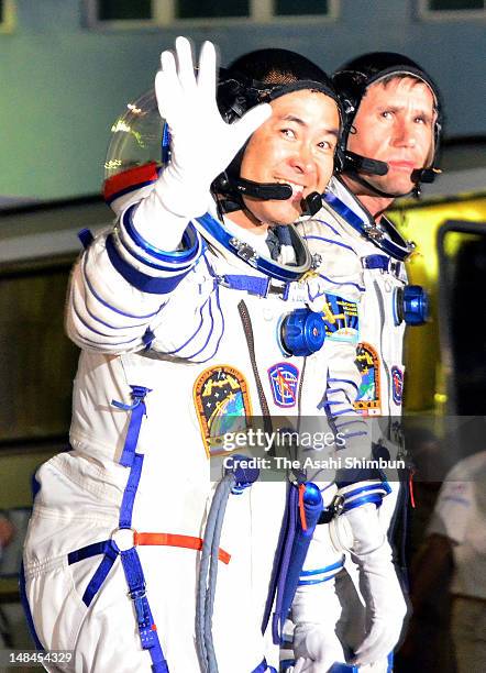 Flight Engineer Akihiko Hoshide gestures prior the launch of Soyuz-FG rocket at the Russian leased Baikonur cosmodrome on July 15, 2012 in Baikonur,...