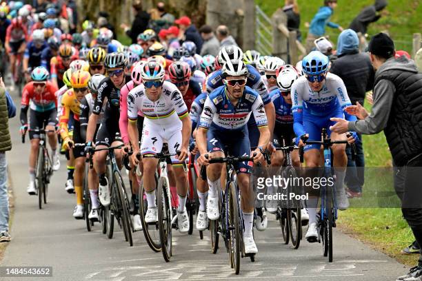 Remco Evenepoel of Belgium, Julian Alaphilippe of France and Team Soudal - Quick Step and Alexandre Balmer of Switzerland and Team Jayco AlUla lead...
