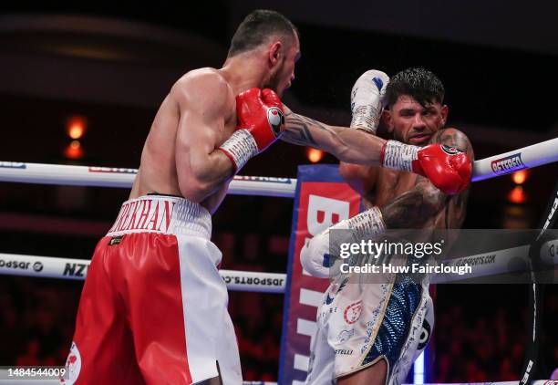 Boxers Joe Cordina Shavkatdzhon Rakhimov in action for the IBF World Super Feather weight title at the Motorpoint Arena Cardiff on April 22, 2023 in...