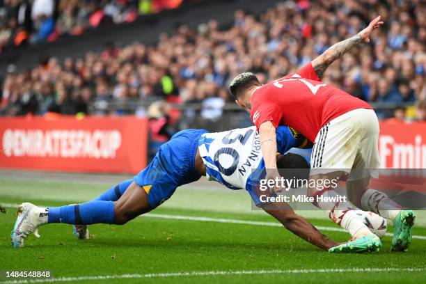 Antony of Manchester United battles for possession with Pervis Estupinan of Brighton & Hove Albion during the Emirates FA Cup Semi Final match...