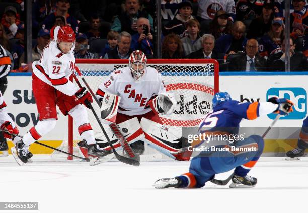 Antti Raanta of the Carolina Hurricanes prepares for a shot by Sebastian Aho of the New York Islanders during the first period in Game Four in the...