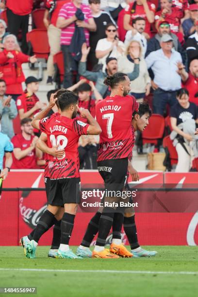 Kang-in Lee of RCD Mallorca celebrates scoring his team´s first goal with teammates during the LaLiga Santander match between RCD Mallorca and Getafe...