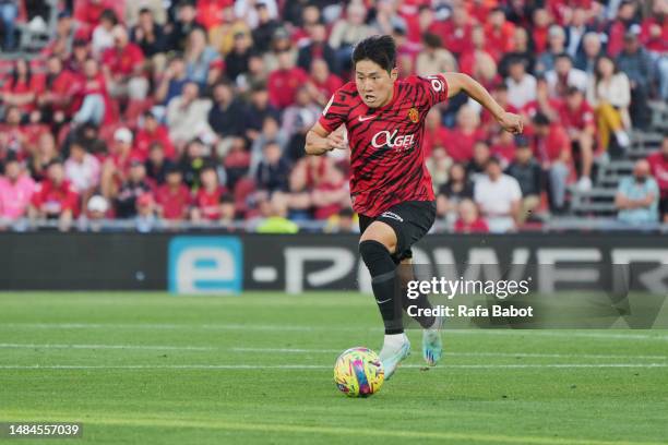 Kang-in Lee of RCD Mallorca runs with the ball during the LaLiga Santander match between RCD Mallorca and Getafe CF at Visit Mallorca Estadi on April...