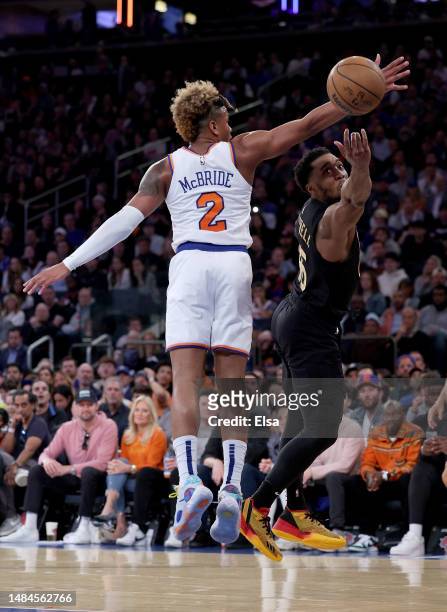Donovan Mitchell of the Cleveland Cavaliers heads for the net as Miles McBride of the New York Knicks defends in the first half during Game Four of...