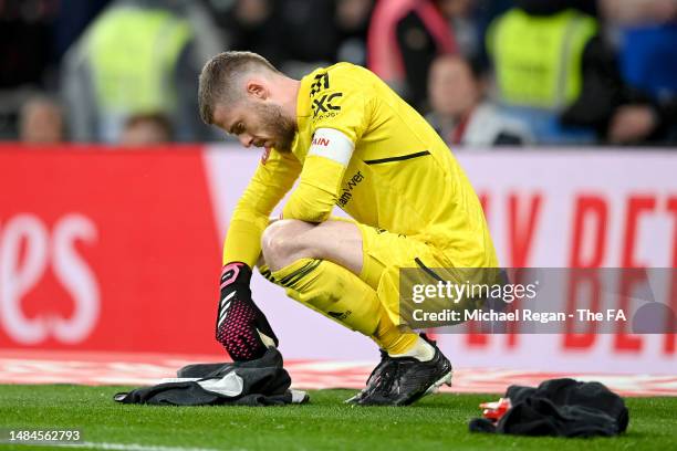 David De Gea of Manchester United reads notes between penalties in the penalty shoot out during the Emirates FA Cup Semi Final match between Brighton...