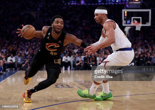 Donovan Mitchell of the Cleveland Cavaliers heads for the net as Josh Hart of the New York Knicks defends in the first half during Game Four of the...