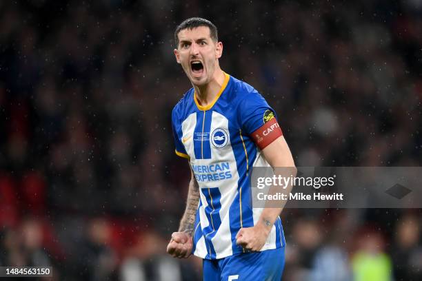 Lewis Dunk of Brighton & Hove Albion celebrates scoring the team's fifth penalty in the penalty shoot out during the Emirates FA Cup Semi Final match...