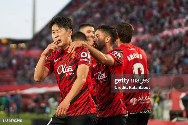 Kang-in Lee of RCD Mallorca celebrates scoring his team´s third goal with teammates during the LaLiga Santander match between RCD Mallorca and Getafe...