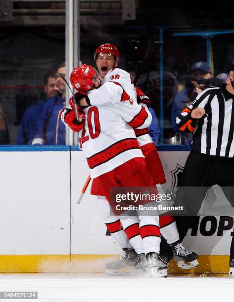 Sebastian Aho of the Carolina Hurricanes celebrates his goal with Mackenzie MacEachern at 13:30 of the second period against the New York Islanders...