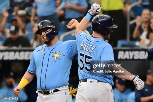 Isaac Paredes and Luke Raley of the Tampa Bay Rays celebrate after scoring in the second inning against the Chicago White Sox at Tropicana Field on...