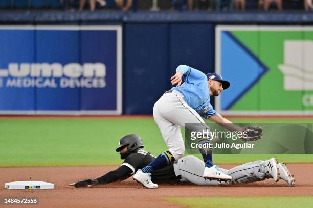 Luis Robert Jr. #88 of the Chicago White Sox steals second base from Brandon Lowe of the Tampa Bay Rays in the first inning at Tropicana Field on...
