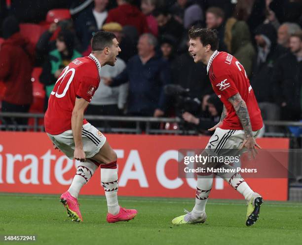 Victor Lindelof of Manchester United celebrates scoring the winning penalty during the Emirates FA Cup Semi Final match between Brighton & Hove...