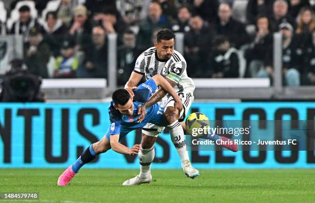 Danilo of Juventus battles for the ball Hirving Lozano of SSC Napoli during the Serie A match between Juventus and SSC Napoli at Allianz Stadium on...