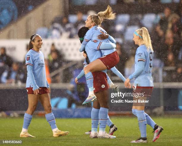 Steph Houghton of Manchester City celebrates with teammates after scoring the team's fifth goal during the FA Women's Super League match between...