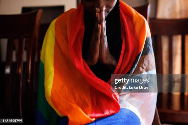 Member of the LGBTQ community prays during an evangelical church service on April 23, 2023 in Kampala, Uganda. Uganda's policymakers have yet to pass...