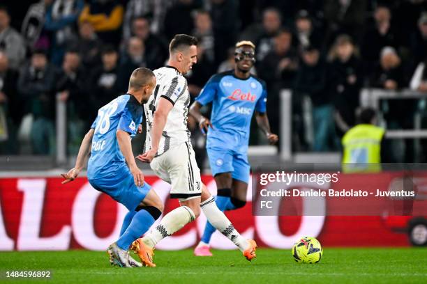 Arkadiusz Krystian Milik of Juventus is challenged by Stanislav Lobotka of SSC Napoli during the Serie A match between Juventus and SSC Napoli at...
