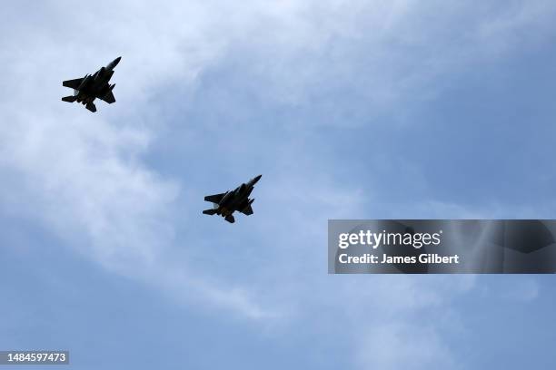 The F-15 159th Fighter Wing, Louisiana Air National Guard perform a flyover during pre-race ceremonies prior to the NASCAR Cup Series GEICO 500 at...