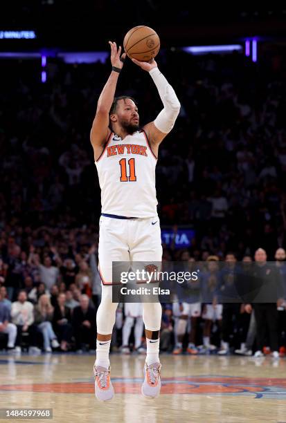 Jalen Brunson of the New York Knicks shoots a three point shot in the fourth quarter against the Cleveland Cavaliers during Game Four of the Eastern...