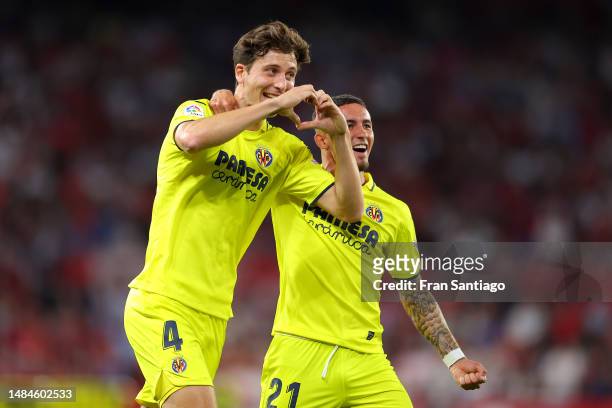 Pau Torres of Villarreal CF celebrates with teammate Yeremi Pino after scoring the team's first goal during the LaLiga Santander match between...