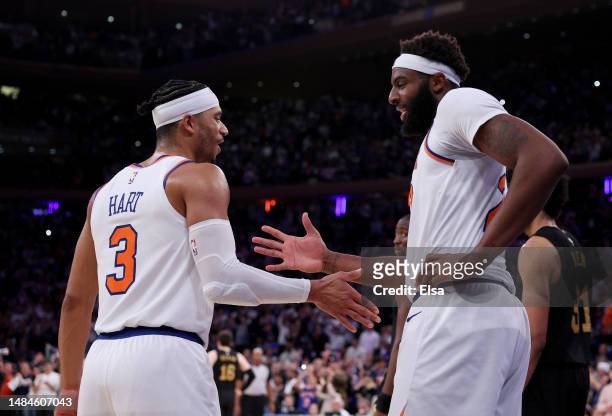 Josh Hart and Mitchell Robinson of the New York Knicks celebrate as the game ends against the Cleveland Cavaliers during Game Four of the Eastern...