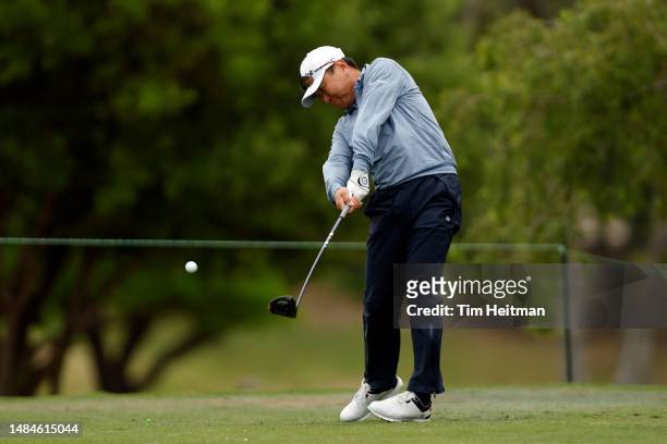 Charlie Wi of South Korea tees off on the seventh hole during the final round of the Invited Celebrity Classic at Las Colinas Country Club on April...