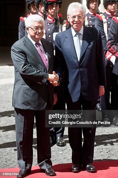 Palestinian president Mahmud Abbas shakes hands with Italian Prime Minister Mario Monti at Palazzo Chigi on July 17, 2012 in Rome, Italy. Palestinian...