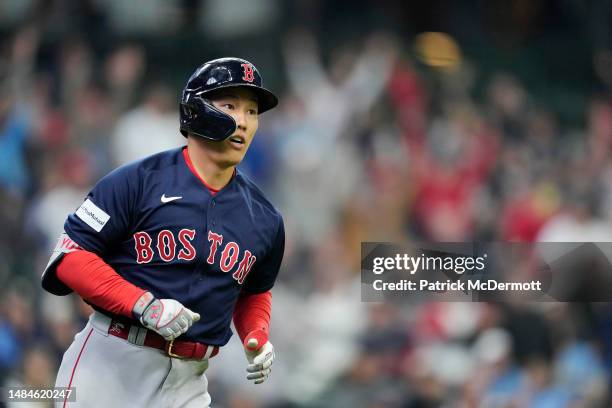 Masataka Yoshida of the Boston Red Sox hits a grand slam in the eighth inning against the Milwaukee Brewers at American Family Field on April 23,...